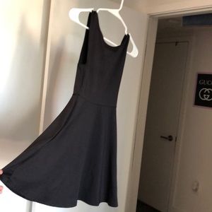 Black high neck open back skater dress